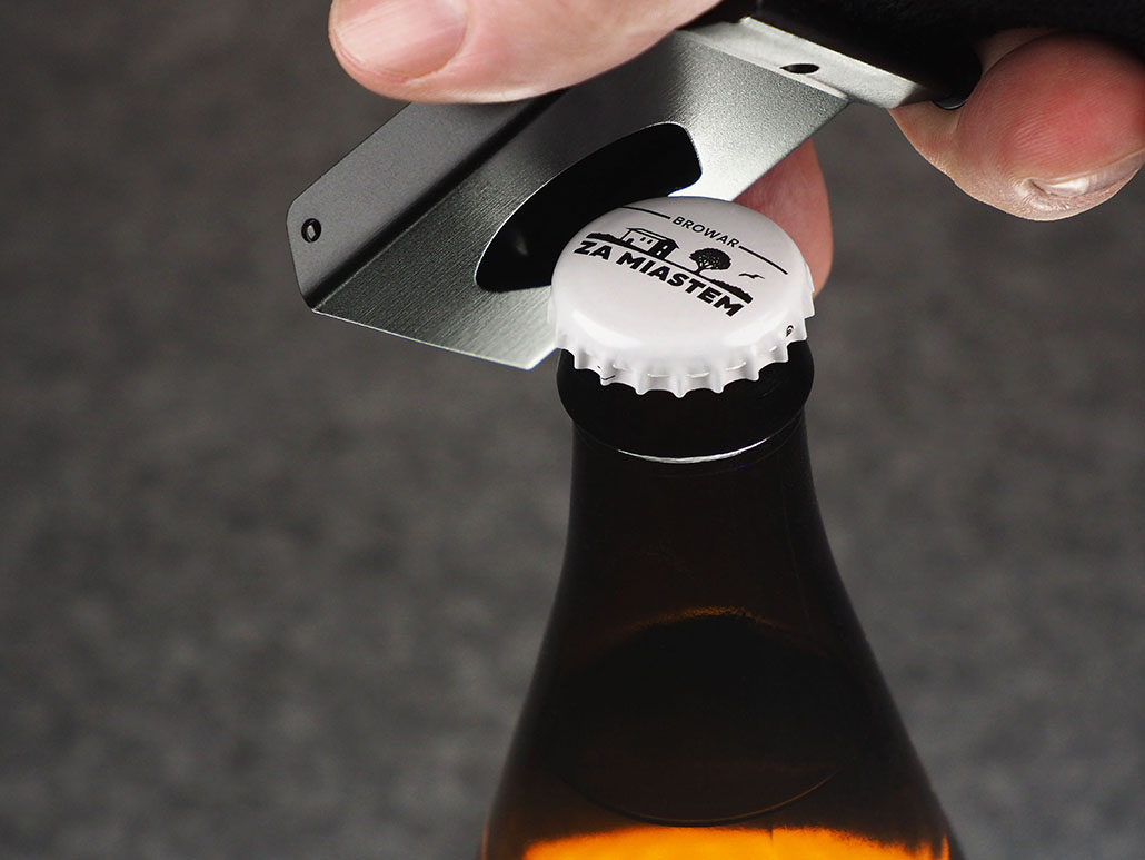 Belt with bottle opener buckle 